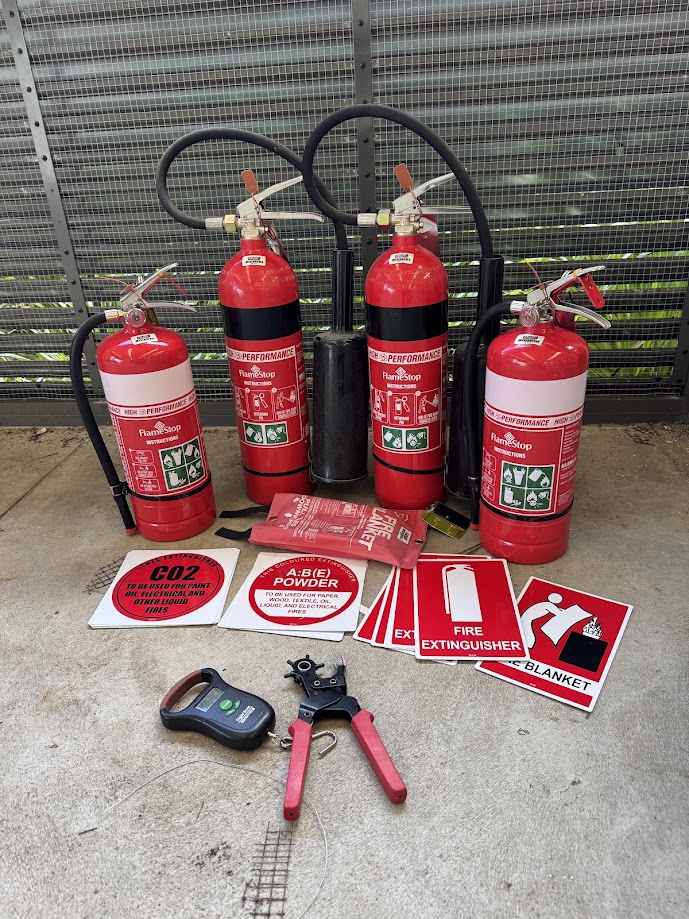 Commercial fire extinguishers, fire blankets, and compliance signage ready for installation in Lismore Northern NSW