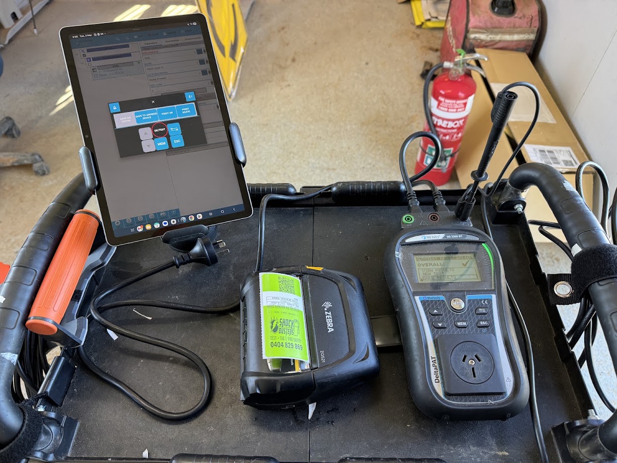 Shock Busters commercial electrical test and tag equipment featuring Metrel DeltaPAT tester and Zebra printer